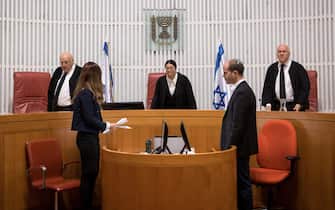 epa08095964 A panel of judges of the Israeli Supreme Court headed by Chief Justice Esther Hayut (C), Deputy Chief Justice Hanan Melcer (L) and Justice Uzi Fogelman (R), ahead of the hearing on the issue of whether Israeli Prime Minister Benjamin Netanyahu could form a government after the upcoming election, in Jerusalem, Israel, 31 December 2019.  EPA/Yonatan Sindel