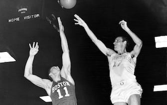 MINNEAPOLIS - 1950:  Jim Pollard of the Minneapolis Lakers shoots a jump shot against the Boston Celtics during the 1950 season in Minneapolis, Minnesota.  NOTE TO USER: User expressly acknowledges and agrees that, by downloading and/or using this Photograph, User is consenting to the terms and conditions of the Getty Images License Agreement  Mandatory Copyright Notice:  Copyright 1950 NBAE  (Photo by NBAE Photos/NBAE via Getty Images)
