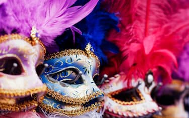 Italy, Veneto, Venice, row of traditional Venitian masks on display