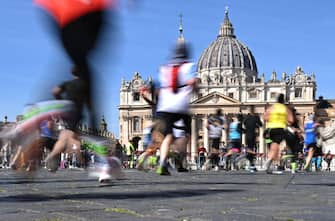 Competitors run in front of St. Peter's square during the Rome Marathon in Rome, on March 17, 2024. (Photo by TIZIANA FABI / AFP) (Photo by TIZIANA FABI/AFP via Getty Images)