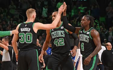 BOSTON, MA - DECEMBER 1: Sam Hauser #30 high fives Jrue Holiday #4 of the Boston Celtics during the game against the Philadelphia 76ers on December 1, 2023 at the TD Garden in Boston, Massachusetts. NOTE TO USER: User expressly acknowledges and agrees that, by downloading and or using this photograph, User is consenting to the terms and conditions of the Getty Images License Agreement. Mandatory Copyright Notice: Copyright 2023 NBAE  (Photo by Brian Babineau/NBAE via Getty Images)