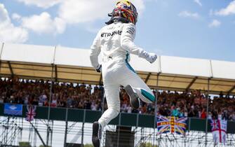 SILVERSTONE, UNITED KINGDOM - JULY 07: Lewis Hamilton, Mercedes AMG F1, jumps from his car as he celebrates after taking Pole Position during the British GP at Silverstone on July 07, 2018 in Silverstone, United Kingdom. (Photo by Steven Tee / LAT Images)
