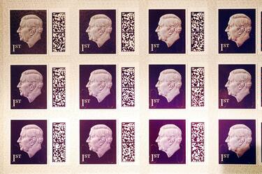 One of the first sheets of the 1st class definitive stamp featuring King Charles III goes on display at the Postal Museum in central London, before they enter circulation later this year. The image used of the King, which shows him facing to the left, is an adapted version of the portrait created by Martin Jennings for the Royal Mint for the obverse of the new UK coinage. Picture date: Tuesday February 7, 2023. (Photo by Victoria Jones/PA Images via Getty Images)