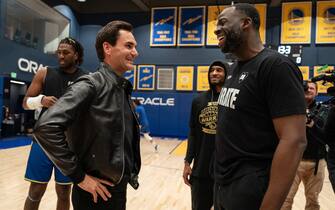 SAN FRANCISCO, CALIFORNIA - MARCH 9: Roger Federer speaks with Draymond Green of the Golden State Warriors before a game while promoting the Laver Cup San Francisco Launch for 2025 at Chase Center on March 9, 2024 in San Francisco, California. (Photo by Loren Elliott/Getty Images for Laver Cup)