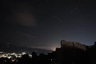 Meteor Shower Shooting star, Perseid on a summer night over a castle