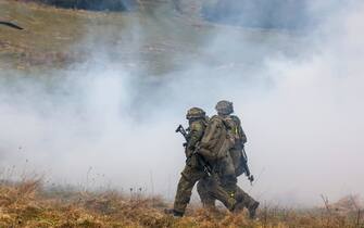 Soldiers of the German military move a soldier, acting injured, to a US Army Black Hawk helicopter during an Allied Spirit 24 multinational training exercise at the Hohenfels Training Area in Hohenfels, Germany, on Saturday, March 16, 2024. Allied Spirit 24 is a U.S. Army exercise for its NATO allies and partners, with participants from countries including Croatia, Denmark, Germany, Hungary, Italy, Lithuania, Netherlands, Spain, the UK and the US. Photographer: Alex Kraus/Bloomberg