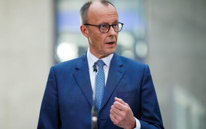 epa11949349 Chairman of the Christian Democratic Union (CDU) party and faction Friedrich Merz gestures at a press conference during ongoing exploratory talks on the premises of the German parliament, the Bundestag, in Berlin, Germany, 08 March 2025. Germany's Christian Democratic Union (CDU) and Social Democratic Party (SPD) continue exploratory talks on forming a potential governing coalition.  EPA/CLEMENS BILAN