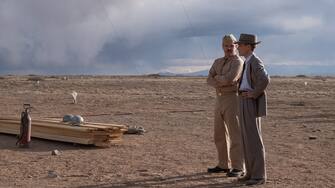 L to R: Matt Damon is Leslie Groves and Cillian Murphy is J. Robert Oppenheimer in OPPENHEIMER, written, produced, and directed by Christopher Nolan.