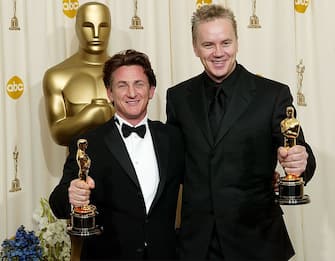 HOLLYWOOD, CA - FEBRUARY 29:  (HOLLYWOOD REPORTER AND US TABS OUT) Actor Sean Penn, winner of Best Actor in a Lead Role for "Mystic River" and actor Tim Robbins, Best Actor in a Supporting Role for Mystic River" pose backstage during the 76th Annual Academy Awards at the Kodak Theater on February 29, 2004 in Hollywood, California.  (Photo by Frank Micelotta/Getty Images)