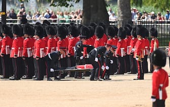 LONDON, ENGLAND - JUNE 10: A Welsh Guardsman is stretchered away while Prince William, Prince of Wales Carries Out The Colonel's Review at Horse Guards Parade on June 10, 2023 in London, England. The Prince of Wales carried out the review of the Welsh Guards for the first time as Colonel of the Regiment. It is the final evaluation of the King's Birthday parade ahead of the event on June 17.  (Photo by Stuart C. Wilson/Getty Images)
