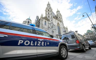 A police car stands near the Stephansdom in Vienna on December 24, 2023. The German daily Bild reported on its website that officials in Austria, Germany and Spain have all received indications that an Islamist group was planning several attacks in Europe, possibly on New Year's Eve and Christmas. (Photo by MAX SLOVENCIK / APA / AFP) / Austria OUT (Photo by MAX SLOVENCIK/APA/AFP via Getty Images)