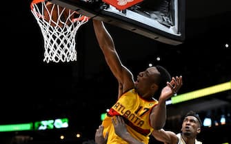 ATLANTA, GA - JANUARY 30: (DUNK SEQUENCE: 2/3) Onyeka Okongwu #17 of the Atlanta Hawks dunks the ball during the game against the Los Angeles Lakers on January 30, 2022 at State Farm Arena in Atlanta, Georgia.  NOTE TO USER: User expressly acknowledges and agrees that, by downloading and/or using this Photograph, user is consenting to the terms and conditions of the Getty Images License Agreement. Mandatory Copyright Notice: Copyright 2022 NBAE (Photo by Adam Hagy/NBAE via Getty Images)