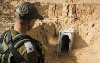 epa06450411 A picture taken 18 January 2018 from the Israeli side of the border with the Gaza Strip shows a Israeli army officer walking near the entrance of a tunnel, that Israel says was dug by the Islamic Jihad group, leading from the Palestinian enclave into Israel, near southern Israeli kibbutz of Kissufim. Israel uncovered and destroyed the tunnel in late October.  EPA/JACK GUEZ / POOL