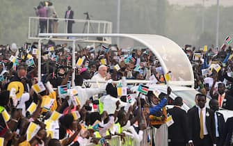 Pope Francis (C) waves as he arrives by popemobile for the holy mass at the John Garang Mausoleum in Juba, South Sudan, on February 5, 2023. - Pope Francis wraps up his pilgrimage to South Sudan with an open-air mass on February 5, 2023 after urging its leaders to focus on bringing peace to the fragile country torn apart by violence and poverty.
The three-day trip is the first papal visit to the largely Christian country since it achieved independence from Sudan in 2011 and plunged into a civil war that killed nearly 400,000 people. (Photo by Tiziana FABI / AFP) (Photo by TIZIANA FABI/AFP via Getty Images)