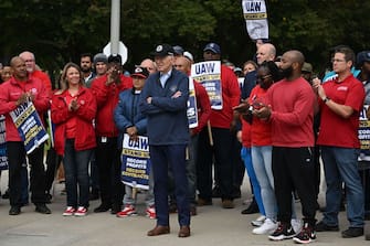 US President Joe Biden joins striking members of the United Auto Workers (UAW) union at a picket line outside a General Motors Service Parts Operations plant in Belleville, Michigan, on September 26, 2023. Some 5,600 members of the UAW walked out of 38 US parts and distribution centers at General Motors and Stellantis at noon September 22, 2023, adding to last week's dramatic worker walkout. According to the White House, Biden is the first sitting president to join a picket line. (Photo by Jim WATSON / AFP) (Photo by JIM WATSON/AFP via Getty Images)