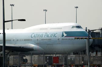 HONG KONG - MARCH 8:  A Cathay Pacific Airways 747 passenger plane is shown on the ground at Chek Lap Kok airport March 7, 2003 in Hong Kong. Cathay Pacific Airways, Hong Kong's largest airliner, has posted a sixfold rise in net profit for 2002 with a rise in passenger and cargo traffic.  (Photo by Christian Keenan/Getty Images)