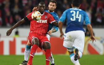 epa06346400 Cologne's Sehrou Guirassy (L) in action with Arsenal's Mathieu Debuchy (C) during the UEFA Europa League group stage soccer match between FC Cologne and Arsenal in Cologne, Germany, 23 November 2017.  EPA/SASCHA STEINBACH