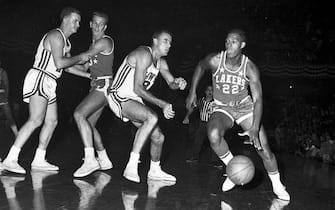 (Original Caption) 11/10/59-ST. LOUIS: Minneapolis Lakers' Elgin Baylor (22) moves in for another tally in 1st quarter action here 11/10 night against St. Louis Hawks. Baylor recently set NBA record with 64 points.
