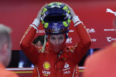 epa11206541 British driver Oliver Bearman of Scuderia Ferrari prepares himself before a practice session for the Formula One Saudi Arabia Grand Prix, at the Jeddah Corniche Circuit in Jeddah, Saudi Arabia, 08 March 2024. Bearman replaces Spanish driver Carlos Sainz who was diagnosed with appendicitis.  EPA/ALI HAIDER