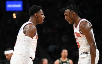 BOSTON, MASSACHUSETTS - MARCH 05: Immanuel Quickley #5 of the New York Knicks reacts with RJ Barrett #9 after scoring against the Boston Celtics during the fourth quarter at the TD Garden on March 05, 2023 in Boston, Massachusetts. NOTE TO USER: User expressly acknowledges and agrees that, by downloading and or using this photograph, User is consenting to the terms and conditions of the Getty Images License Agreement. (Photo by Brian Fluharty/Getty Images)