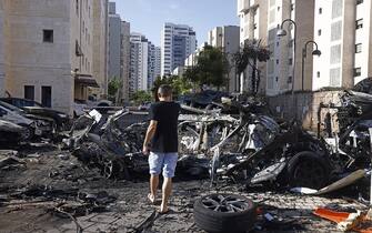 Cars damaged during a rocket attack in Ashqelon, Israel, on Saturday, Oct. 7. 2023. Israel declared a rare state of alert for war on Saturday after militants fired an estimated 2,200 missiles from the Gaza Strip and infiltrated southern parts of the country. Photographer: Kobi Wolf/Bloomberg via Getty Images