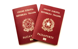 Italian biometric e-passports on a white background