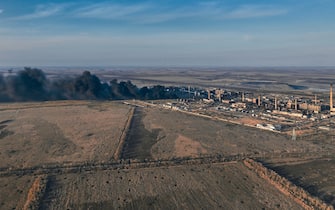 AVDIIVKA DISTRIKT, UKRAINE - FEBRUARY 15:  (EDITOR'S NOTE: No new use of feed image after March 16, 2024. After that date, image will need to be licensed from the website.) A general view of smoke rising from the Avdiivka Coke and Chemical Plant on February 15, 2024 in Avdiivka district, Ukraine. The Russian army is advancing on the flanks of the city, firing non-stop artillery, shelling the city with guided aerial bombs (FAB-500). Both Ukraine and Russia have recently claimed gains in the Avdiivka, where Russia is continuing a long-running campaign to capture the city, located in the Ukraine's eastern Donetsk Region. Last week, the Russian army was successful in advancing towards the city and captured the main supply road (Photo by Kostiantyn Liberov/Libkos/Getty Images)
