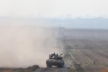 epa11264262 An Israeli army tank moves along the border with Gaza in southern Israel , 07 April 2024. Israel marks six months since the October 07 attacks, as 134 hostages are currently still being held captive in Gaza, according to the Israeli IDF. More than 33,000 Palestinians and over 1,450 Israelis have been killed, according to the Palestinian Health Ministry and the Israel Defense Forces (IDF), since Hamas militants launched an attack against Israel from the Gaza Strip on 07 October 2023, and the Israeli operations in Gaza and the West Bank which followed it.  EPA/ABIR SULTAN