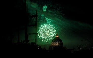 Fireworks on new year's eve over Saint Peter's Dome are seen in Rome, Italy, 31 December 2020. ANSA/RICCARDO ANTIMIANI