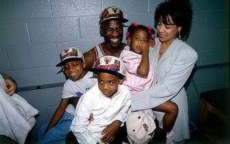 CHICAGO - JUNE 16:  Michael Jordan #23 of the Chicago Bulls celebrates with his family after winning the 1996 NBA title against the Seattle SuperSonics in Game Six of the 1996 NBA Finals at the United Center on June 16, 1996 in Chicago Iillinois.  The Bulls won 87-75. NOTE TO USER: User expressly acknowledges that, by downloading and or using this photograph, User is consenting to the terms and conditions of the Getty Images License agreement. Mandatory Copyright Notice: Copyright 1996 NBAE (Photo by Andrew D. Bernstein/NBAE via Getty Images)