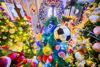 30 November 2023, Lower Saxony, Rinteln: Christmas trees with football-themed decorations can be found in the Jeromin family home in the Schaumburg district. 555 Christmas trees and almost 108,000 Christmas baubles: During Advent, the Jeromin family home shines as a colorful Christmas world. Photo: Julian Stratenschulte/dpa (Photo by Julian Stratenschulte/picture alliance via Getty Images)