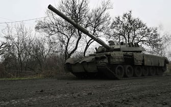A Ukrainian tank rolls on a muddy road near Bakhmut, Donetsk region, on March 29, 2023, amid the Russian invasion of Ukraine. (Photo by Genya SAVILOV / AFP) (Photo by GENYA SAVILOV/AFP via Getty Images)