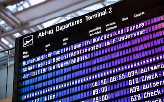 17 January 2024, Bavaria, Munich: The lettering "Due to the weather situation in Munich and Europe, there will be disruptions to air traffic. We ask for your understanding." can be seen on a display board in a departure hall at Munich Airport. Due to the wintry weather conditions, some flights are being canceled at Munich Airport. Photo: Matthias Balk/dpa (Photo by Matthias Balk/picture alliance via Getty Images)