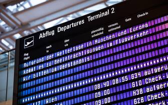 17 January 2024, Bavaria, Munich: The lettering "Due to the weather situation in Munich and Europe, there will be disruptions to air traffic. We ask for your understanding." can be seen on a display board in a departure hall at Munich Airport. Due to the wintry weather conditions, some flights are being canceled at Munich Airport. Photo: Matthias Balk/dpa (Photo by Matthias Balk/picture alliance via Getty Images)