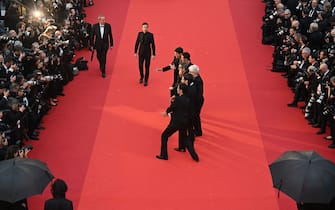 Spanish actor Manu Rios, Spanish actor Jason Fernandez, US actor and writer, Ethan Hawke, Spanish film director Pedro Almodovar, Italian designer Anthony Vaccarello, Portuguese actor Jose Condessa and actor George Steane arrive for the screening of the film "Extrana Forma de Vida" (Strange Way of Life) during the 76th edition of the Cannes Film Festival in Cannes, southern France, on May 17, 2023. (Photo by Antonin THUILLIER / AFP) (Photo by ANTONIN THUILLIER/AFP via Getty Images)