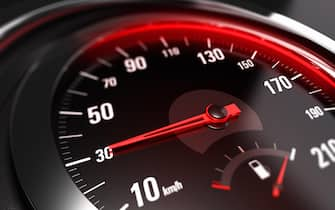 Close up of a car speedometer with the needle pointing 30 Km h, blur effect, conceptual image for safe driving concept