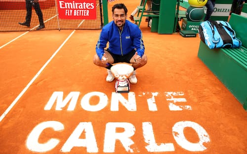 MONTE-CARLO, MONACO - APRIL 21:  Fabio Fognini of Italy poses for a photograph with his winners trophy and the Monte Carlo court logo after his straight sets victory against Dusan Lajovic of Serbia in the men's singles final during day eight of the Rolex Monte-Carlo Masters at Monte-Carlo Country Club on April 21, 2019 in Monte-Carlo, Monaco. (Photo by Clive Brunskill/Getty Images)