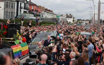 Fans of singer Sinead O'Connor line the streets for a "last goodbye" to the Irish singer as her funeral cortege passes through her former hometown of Bray, Co Wicklow, ahead of a private burial service. Picture date: Tuesday August 8, 2023.