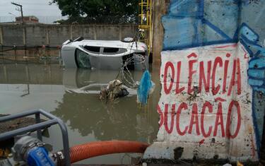 Picture of a car which was swept into the flooded railways of the Acari metro station after heavy rains caused destruction in the suburbs of Rio de Janeiro, Brazil, on January 14, 2024. At least four people died in Rio de Janeiro after heavy rains hit the city early Sunday morning, the local fire brigade confirmed to AFP. (Photo by BRUNO KAIUCA / AFP) (Photo by BRUNO KAIUCA/AFP via Getty Images)