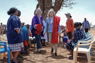US First Lady Jill Biden (C) interacts with women from the Maasai community at Loseti village in Kajiado county, Kenya, on February 26, 2023 where she heard about the impoverishing impact of drought to the herder community during the third day of her visit to Kenya where she toured a drought response site to highlight the impacts of drought on communities. (Photo by Tony KARUMBA / AFP) (Photo by TONY KARUMBA/AFP via Getty Images)