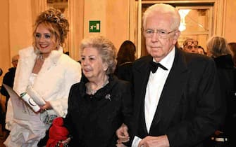 Former Italian Premier Mario Monti (R) with his wife arrives for the La Scala opera house's season opener to attend Giuseppe Verdi's Don Carlo, in Milan, Italy, 7 December 2023. The Scala opera house season opener is considered one of the highlights of the European cultural calendar.ANSA/DANIEL DAL ZENNARO
