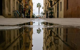 Mandatory Credit: Photo by David Canales/SOPA Images/Shutterstock (14413781a)
Reflection in a puddle in the Barceloneta neighborhood during the Storm Nelson. View of Barceloneta beach in Barcelona, Spain during the Storm Nelson, which has kept ten Spanish communities on yellow alert during this Holy Week due to rain, wind or snow.
Storm Nelson in Barcelona, Spain - 31 Mar 2024