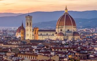 Florence Cathedral (Duomo) over city center at sunset, Italy