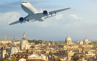 Airlpane over cityscape of Rome, Italy.