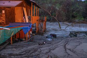 SPRINGVVILLE, CA - MARCH 10: Damaged homes and property are seen in the aftermath of a flash flood on March 10, 2023 near Springville, California. Another in a series of atmospheric river storms from the Pacific Ocean has brought a warm rain to the region, which is falling on top of, and melting, large areas of snow in the Sierra Nevada Mountains, increasing the risk of floods at lower elevations. This years  destructive and deadly storms have produced heavy rains and a near-record snowpack in the Sierras, which provides water for millions of Californians. As a result of one of Californias wettest winters on record, most of the state has gotten relief from years of drought. (Photo by David McNew/Getty Images)