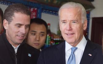 epa08873567 (FILE) - Then US Vice President Joe Biden (R) tours a Hutong alley with his son Hunter Biden (L) in Beijing, China, 05 December 2013 (reissued 09 December 2020). Hunter Biden, the son of US President-elect Joe Biden, said in a statement that the federal prosecutors in Delaware are conducting an investigation of his tax affairs.  EPA/ANDY WONG / POOL *** Local Caption *** 55498958