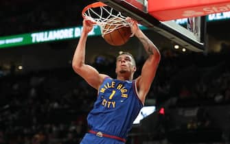 PORTLAND, OREGON - FEBRUARY 23: Michael Porter Jr. #1 of the Denver Nuggets dunks against the Portland Trail Blazers during the third quarter at Moda Center on February 23, 2024 in Portland, Oregon. NOTE TO USER: User expressly acknowledges and agrees that, by downloading and or using this photograph, User is consenting to the terms and conditions of the Getty Images License Agreement.  (Photo by Amanda Loman/Getty Images)