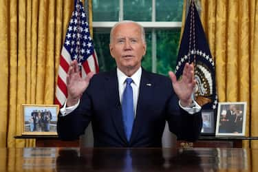 US President Joe Biden speaks during an address to the nation about his decision to not seek reelection, in the Oval Office at the White House in Washington, DC, on July 24, 2024. US President Joe Biden will give an Oval Office speech July 24, 2024 to explain his historic decision to drop out of the 2024 election and pass the torch to Kamala Harris, with the White House denying any cover up over his health. In his first address to the nation since quitting the race, the 81-year-old is expected to burnish his legacy and deny he will spend six months as a lame duck president. (Photo by Evan Vucci / POOL / AFP) (Photo by EVAN VUCCI/POOL/AFP via Getty Images)