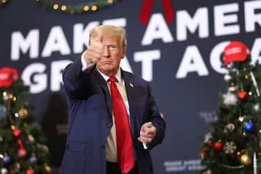 WATERLOO, IOWA - DECEMBER 19: Republican presidential candidate and former U.S. President Donald Trump gestures as he wraps up a campaign event on December 19, 2023 in Waterloo, Iowa. Iowa Republicans will be the first to select their party's nomination for the 2024 presidential race, when they go to caucus on January 15, 2024. (Photo by Scott Olson/Getty Images)