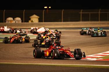 BAHRAIN, BAHRAIN - MARCH 20: Charles Leclerc of Monaco driving (16) the Ferrari F1-75 leads the field at the restart following a safety car period during the F1 Grand Prix of Bahrain at Bahrain International Circuit on March 20, 2022 in Bahrain, Bahrain. (Photo by Clive Mason/Getty Images)